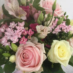 A selection of pink, pale pink and cream flowers including Sweet Avalanche Roses, Cream Avalanche Roses, Pink Bouvardia, Freesias, Pink Eustoma and foliage. Hand tied, aqua packed and presented in a gift bag.